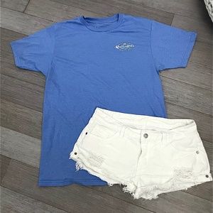blue T-shirt & white low waisted shorts